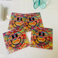Happy Face Glass Coasters Set – 4" colorful coasters for drinks, perfect for protecting surfaces.