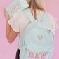 Solid backpack perfect for school, gym, or travel. Features easy clean lining and a spot clean exterior. Dimensions are 16" x 11" x 5", making it ideal for students and everyday use. Durable and versatile for multiple occasions.