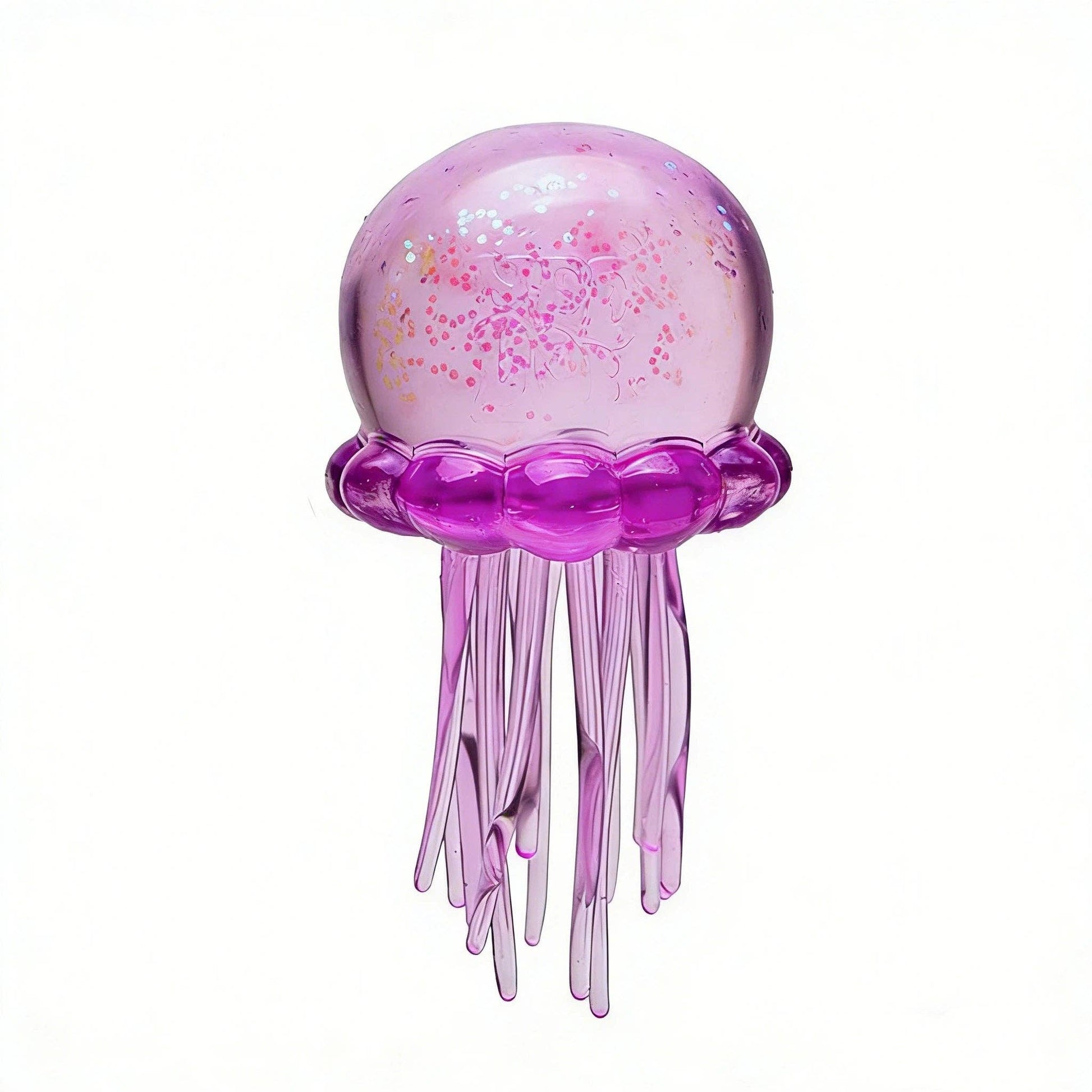 Pink jellyfish-shaped object with glitter on a white background