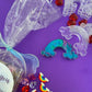 Rainbow sensory kit featuring handmade rainbow swirl glitter dough infused with confetti, miniature sensory charm mix, and soft glitter pompoms. Designed to engage senses and inspire creativity for toddlers and kids ages 3+. Promotes brain development, fine motor skills, and emotional growth. Includes small parts; parental supervision recommended.