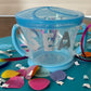 Spill-proof snack pack for toddlers that holds 9 ounces of snacks, featuring a design that fits most standard cup holders. Dishwasher safe for easy cleaning.