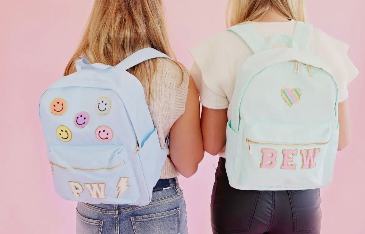 Solid backpack perfect for school, gym, or travel. Features easy clean lining and a spot clean exterior. Dimensions are 16" x 11" x 5", making it ideal for students and everyday use. Durable and versatile for multiple occasions.
