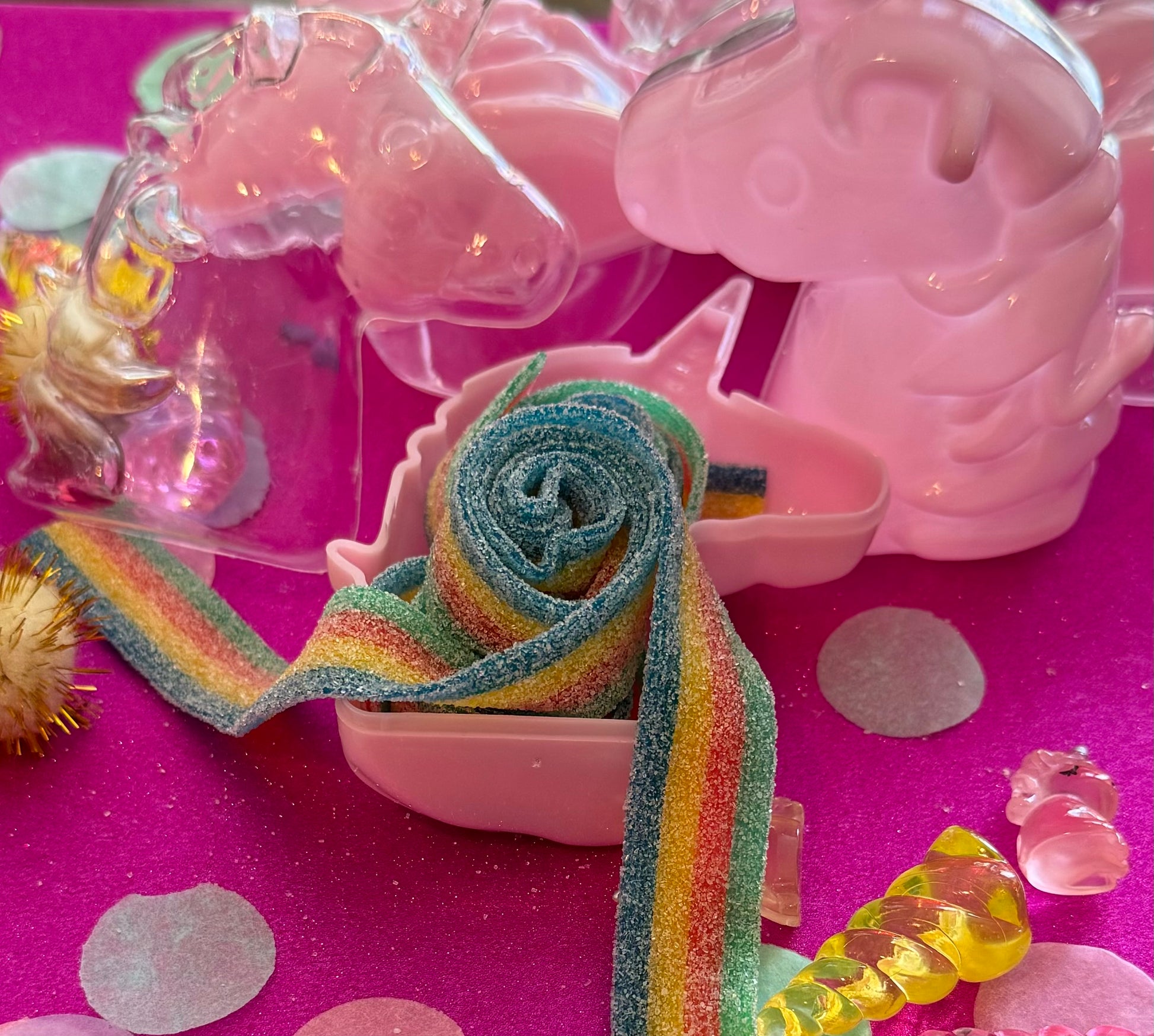 Unicorn-themed candy favor in a magical candy box featuring rainbow sour candy tails. Perfect for birthday parties and kids' celebrations. Enjoy a delightful sensory adventure with this fun and whimsical treat. Color may vary from photos.