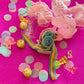 Unicorn-themed candy favor in a magical candy box featuring rainbow sour candy tails. Perfect for birthday parties and kids' celebrations. Enjoy a delightful sensory adventure with this fun and whimsical treat. Color may vary from photos.