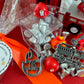 Delight in our Firetruck Themed candy favor, perfect for birthdays and firehouse play dates. This magical treat comes in a perfectly sized square plastic box filled with chocolate 'kisses' themed with firetruck labels. Each box is wrapped in cellophane and can include a thank you label. Explore more candy container options. Ideal for fire truck, firefighter, and tractor-themed parties, ensuring a delicious and fun addition to your celebration.