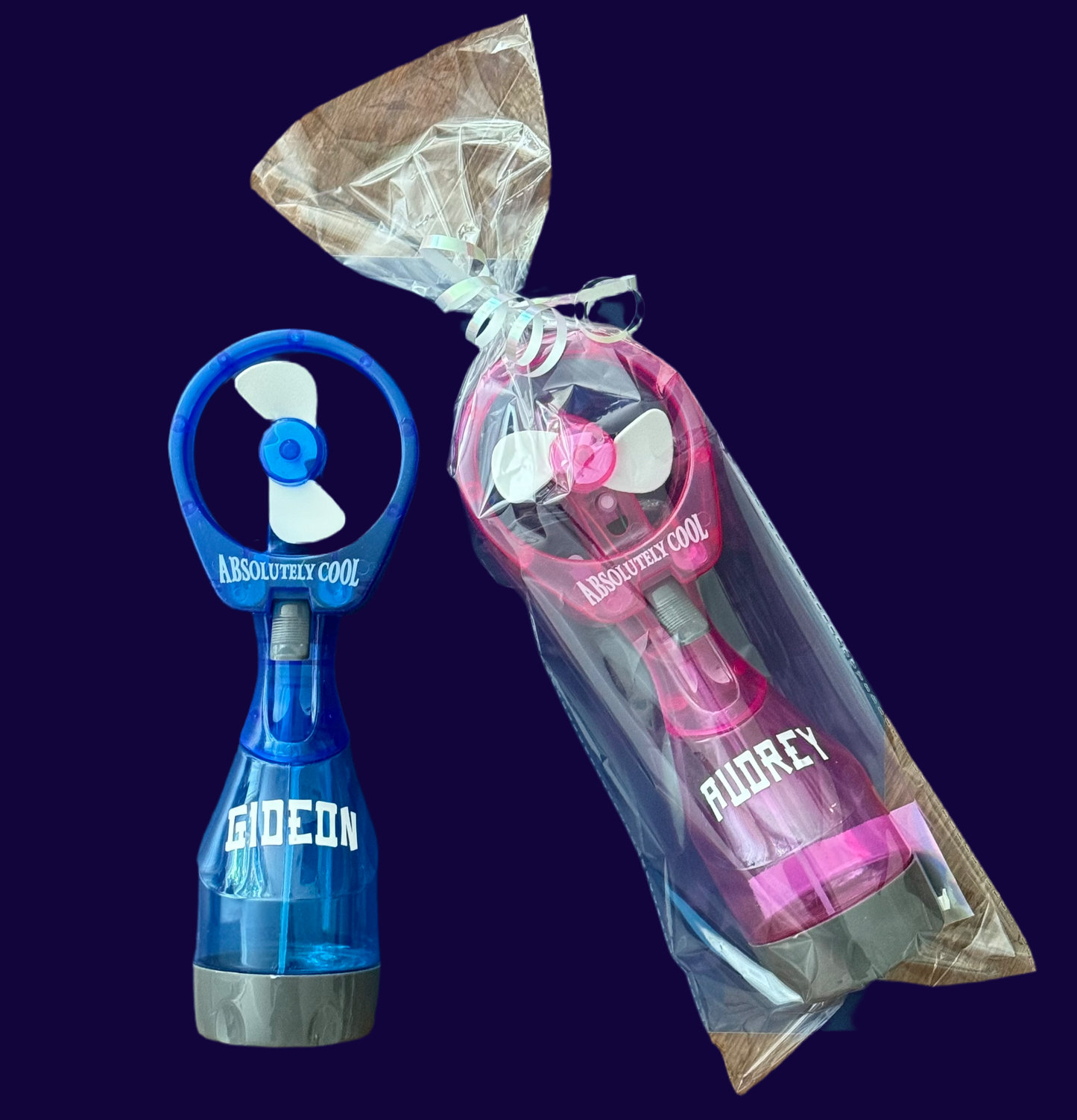 Personalized mini misting fan, perfect for parties and outdoor outings. This portable, battery-operated fan provides a fine mist of cold water and features a powerful motor for a refreshing breeze. Ideal for kids at the beach, park, or theme parks, with colorful designs for everyone.