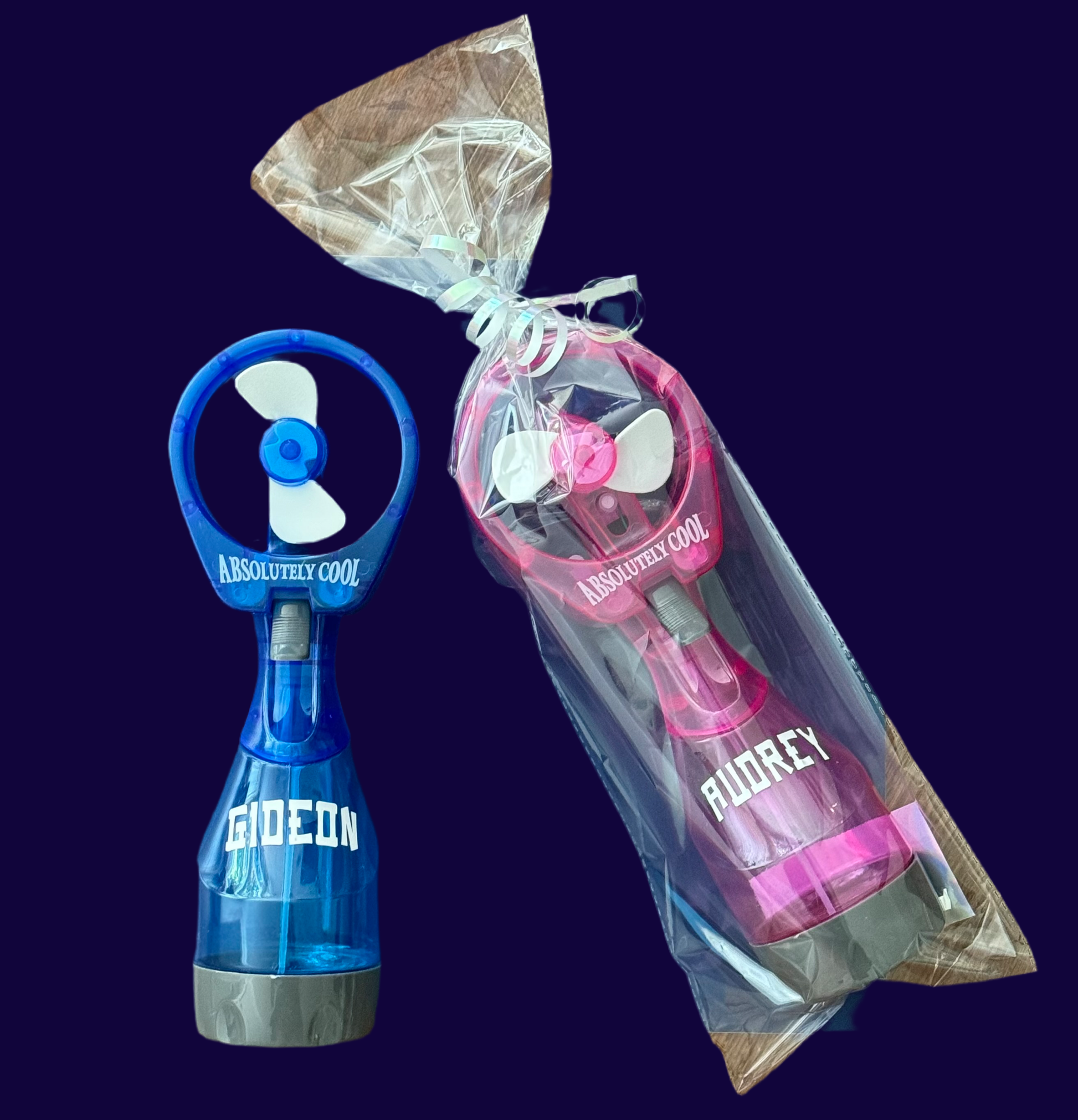 Personalized mini misting fan, perfect for parties and outdoor outings. This portable, battery-operated fan provides a fine mist of cold water and features a powerful motor for a refreshing breeze. Ideal for kids at the beach, park, or theme parks, with colorful designs for everyone.