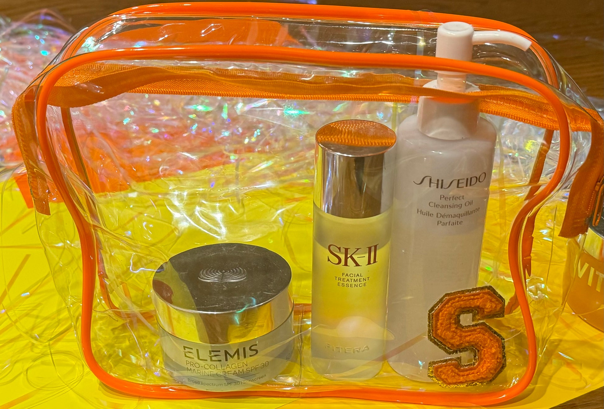 Personalized "All that Glitters" skincare pouch, perfect for storing skincare essentials. The pouch is customized with a name and favorite icons, making it an ideal party favor for pampering yourself or gifting to friends.