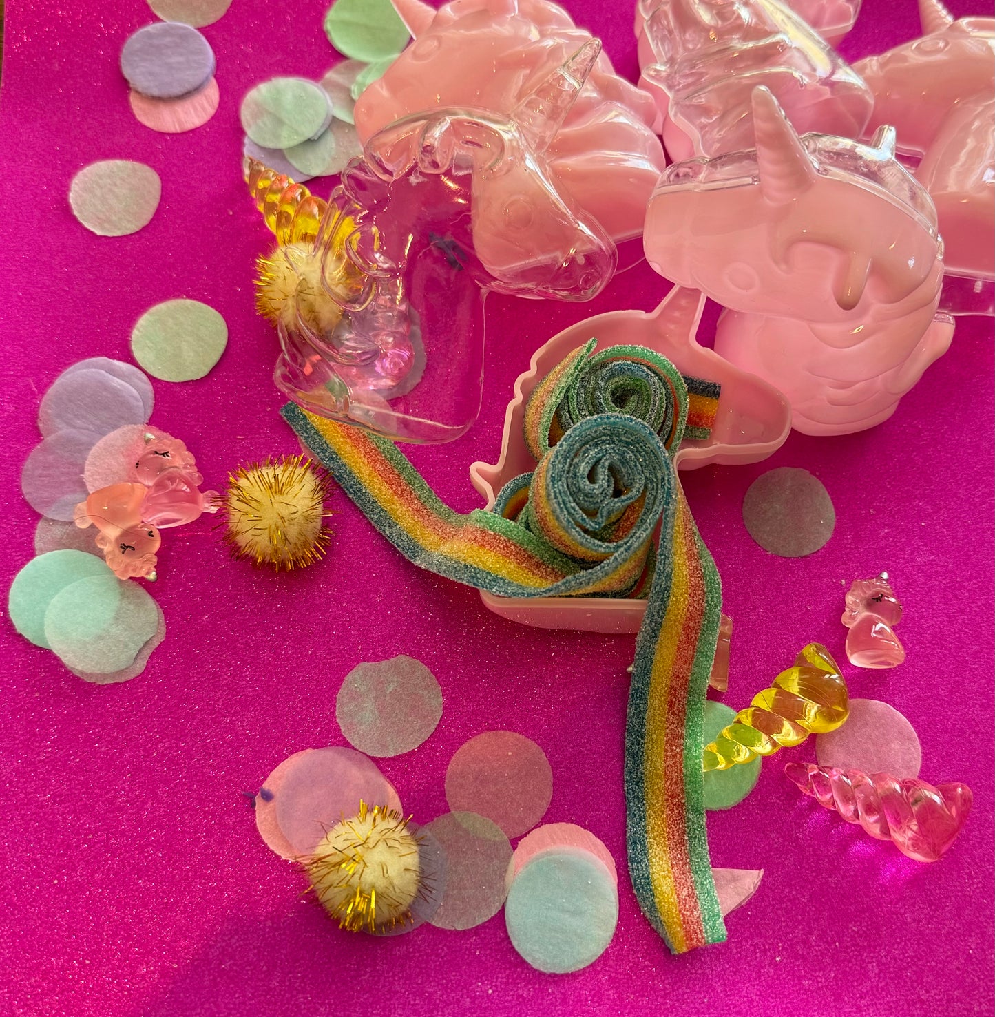 Unicorn-themed candy favor in a magical candy box featuring rainbow sour candy tails. Perfect for birthday parties and kids' celebrations. Enjoy a delightful sensory adventure with this fun and whimsical treat. Color may vary from photos.