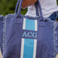 Stylish City Stripe Tote featuring a unique monogram design, perfect for city-goers to carry essentials in style.