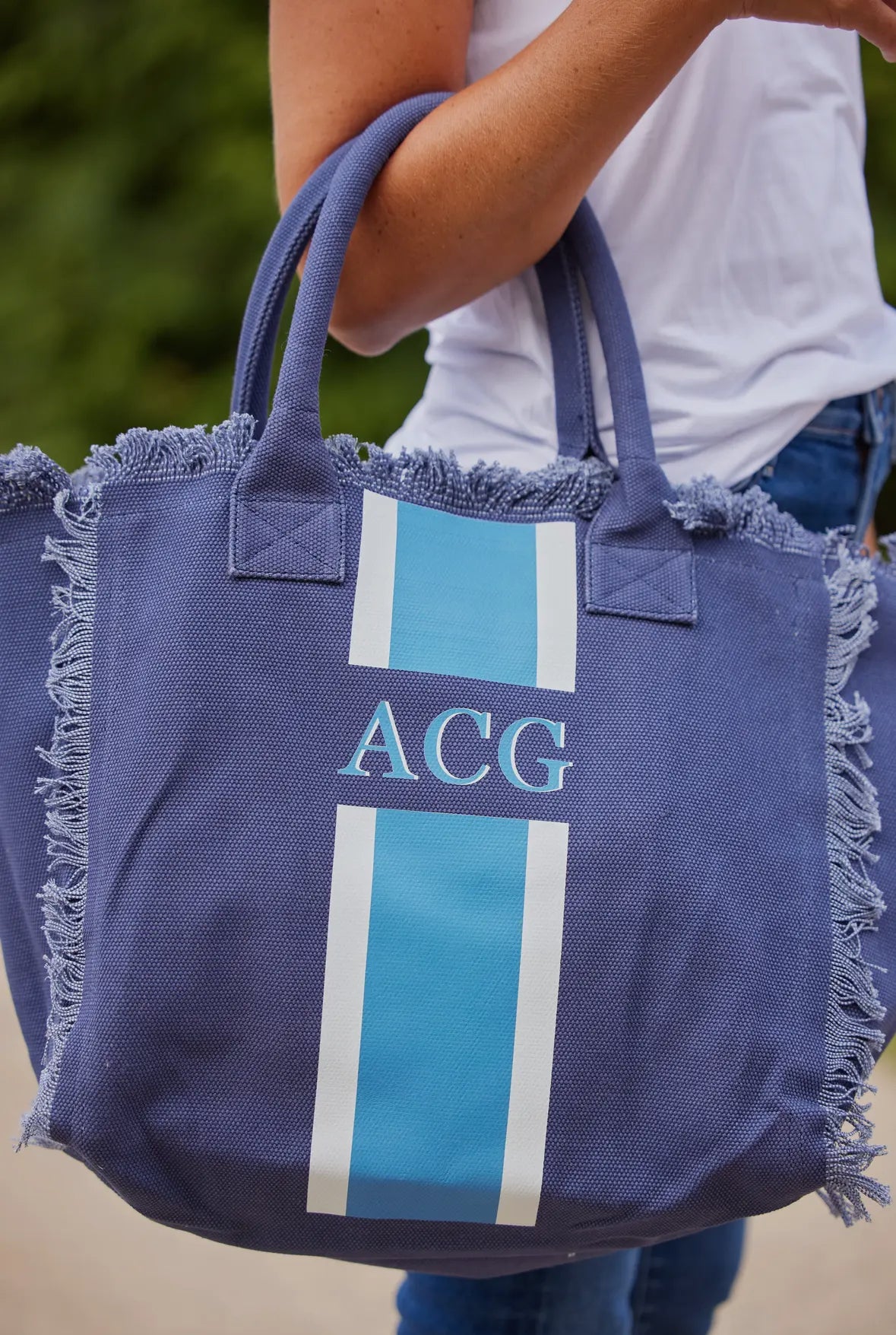Stylish City Stripe Tote featuring a unique monogram design, perfect for city-goers to carry essentials in style.