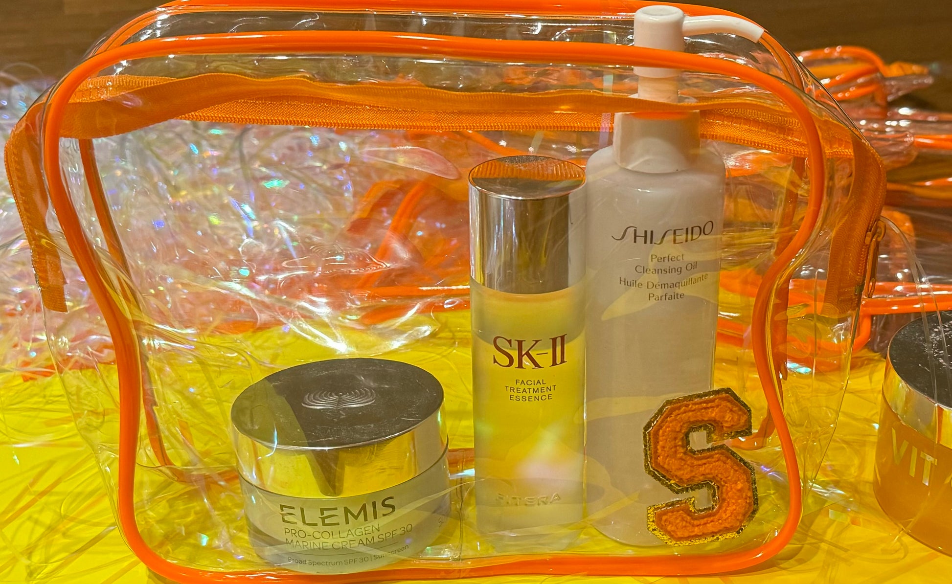 Personalized "All that Glitters" skincare pouch, perfect for storing skincare essentials. The pouch is customized with a name and favorite icons, making it an ideal party favor for pampering yourself or gifting to friends.