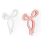 Jumbo bow claw clips in pink and white, trendy and stylish hair accessories for all hair types.