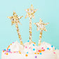Oversized star-shaped confetti cake toppers in pearl and gold, ideal for Sweet 16 and Quinceanera.