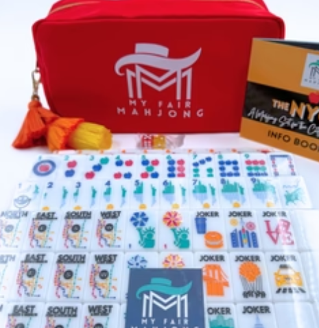 Players holding NYC Series Mahjong tiles