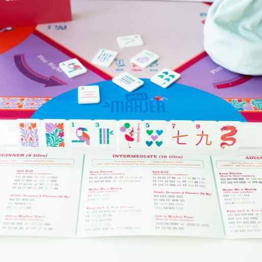 Kid-friendly Mahjong board game with teaching cards