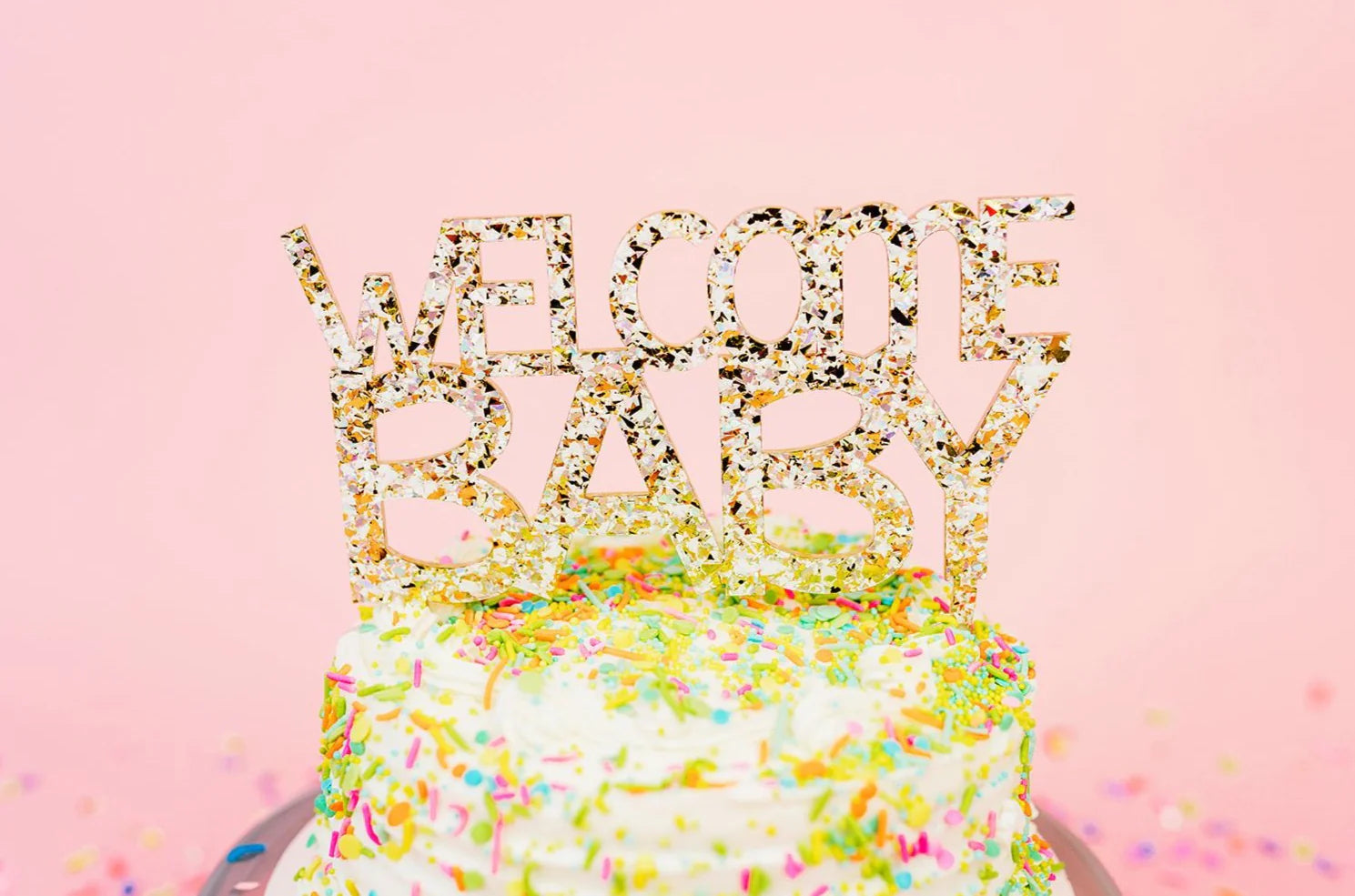 "Welcome Baby" acrylic cake toppers with silver hologram foil, great for baby shower cakes.