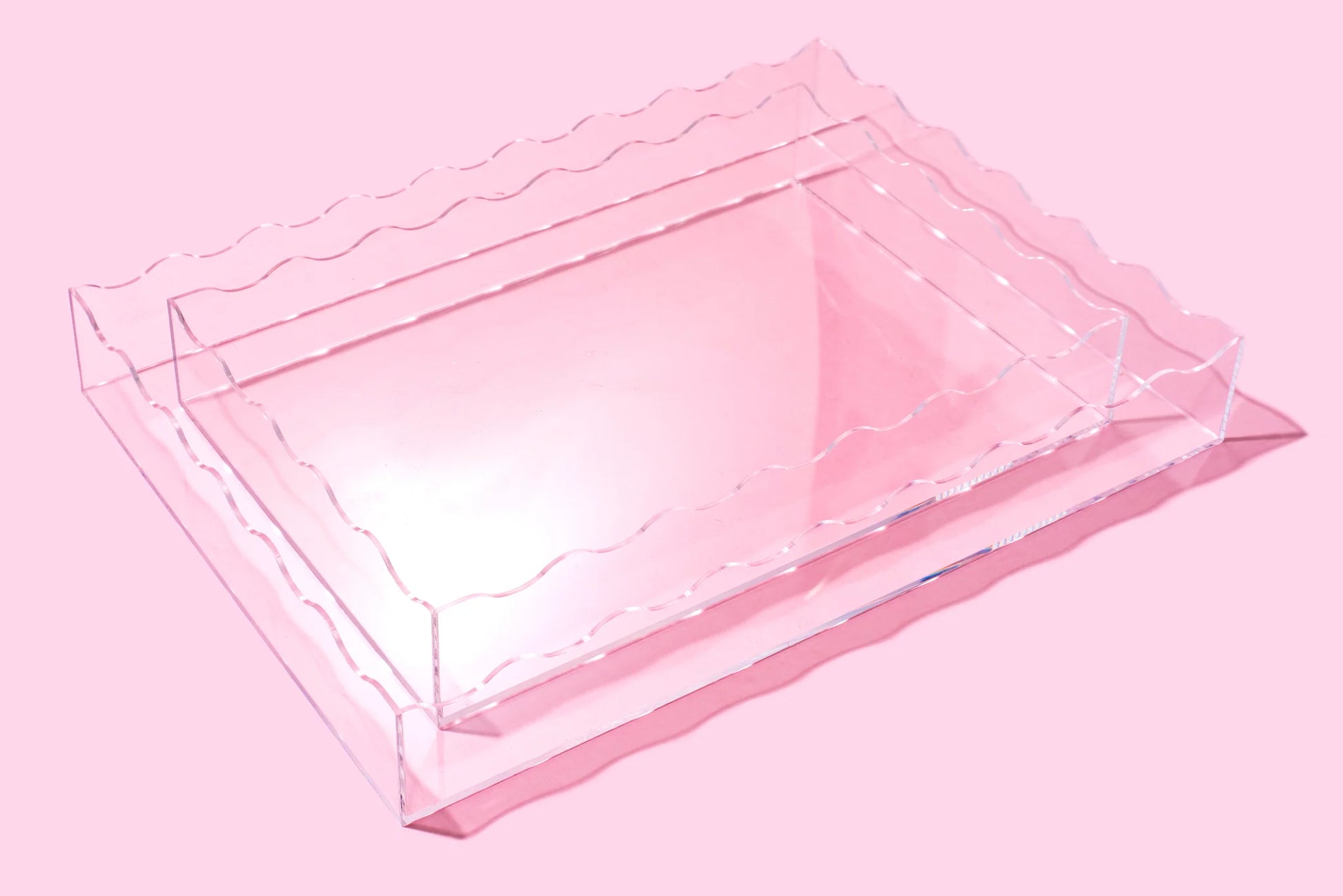 Sleek, clear acrylic wavy rectangle tray, 13" x 18", perfect for retail or office organization.