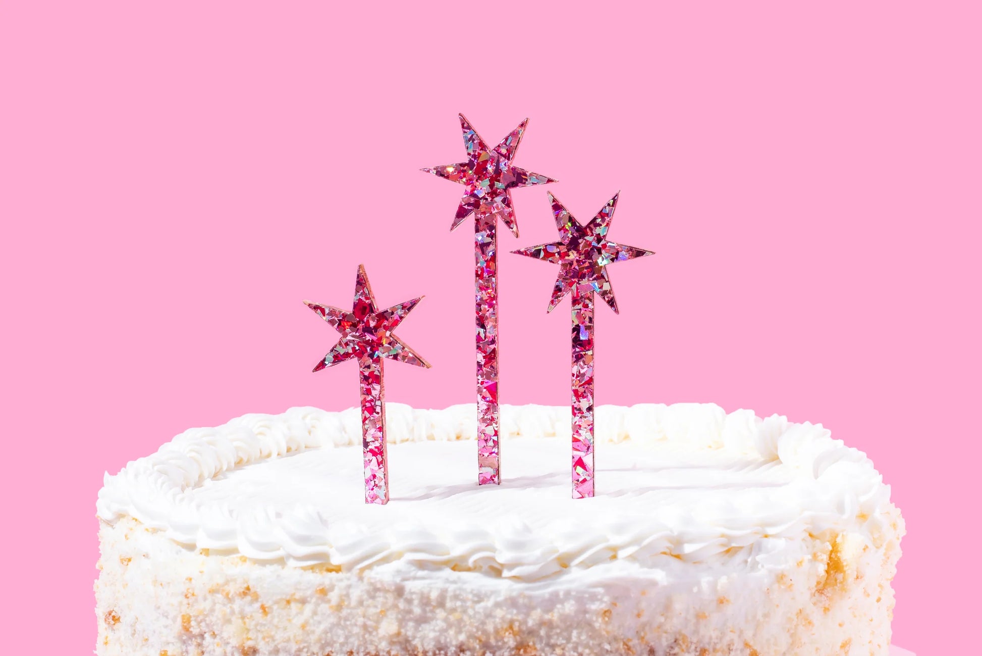 Reusable pink confetti stars cake toppers with gold foil, perfect for birthdays and baby showers.