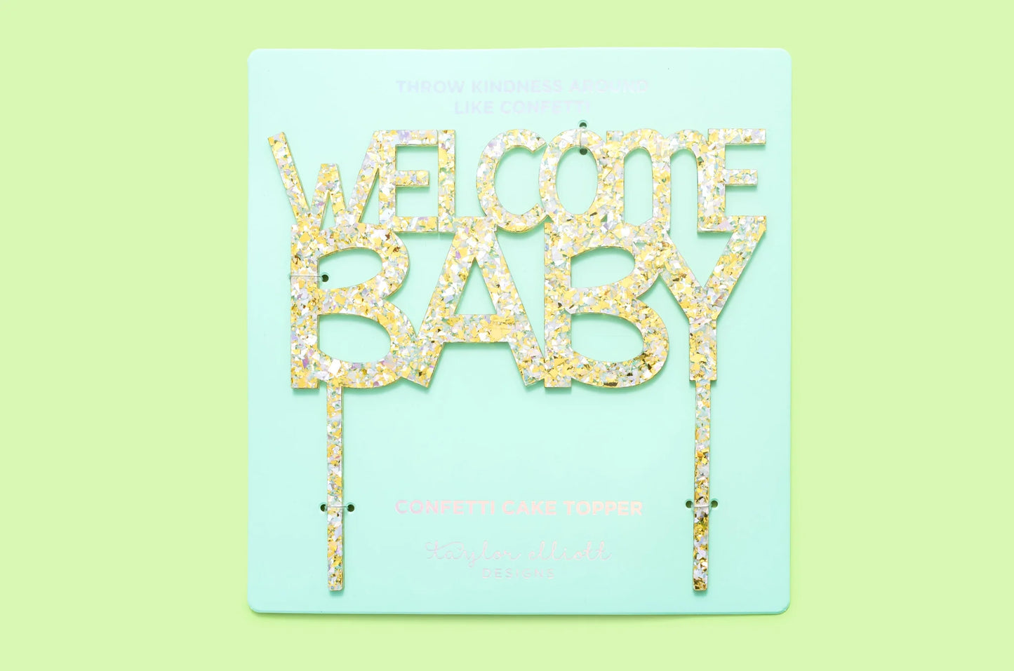 Handmade "Welcome Baby" cake toppers with confetti and sparkle, perfect for party decor.