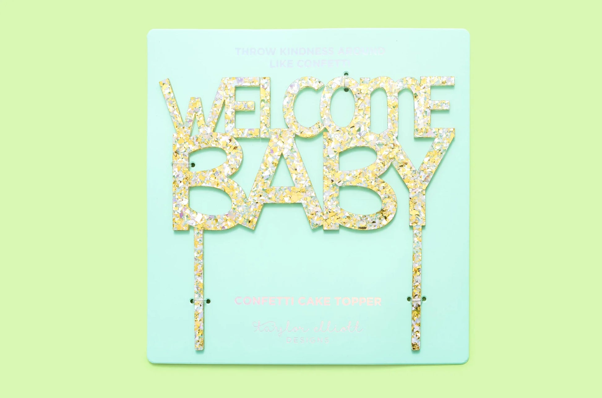Handmade "Welcome Baby" cake toppers with confetti and sparkle, perfect for party decor.