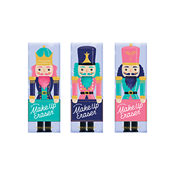 Nutcracker Gift Set by Makeup Eraser, featuring three colorful nutcracker-themed packaging designs. Includes reusable pink and teal makeup remover cloths with a soft, plush texture. Perfect for the holiday season, skincare gifts, or sustainable beauty enthusiasts.