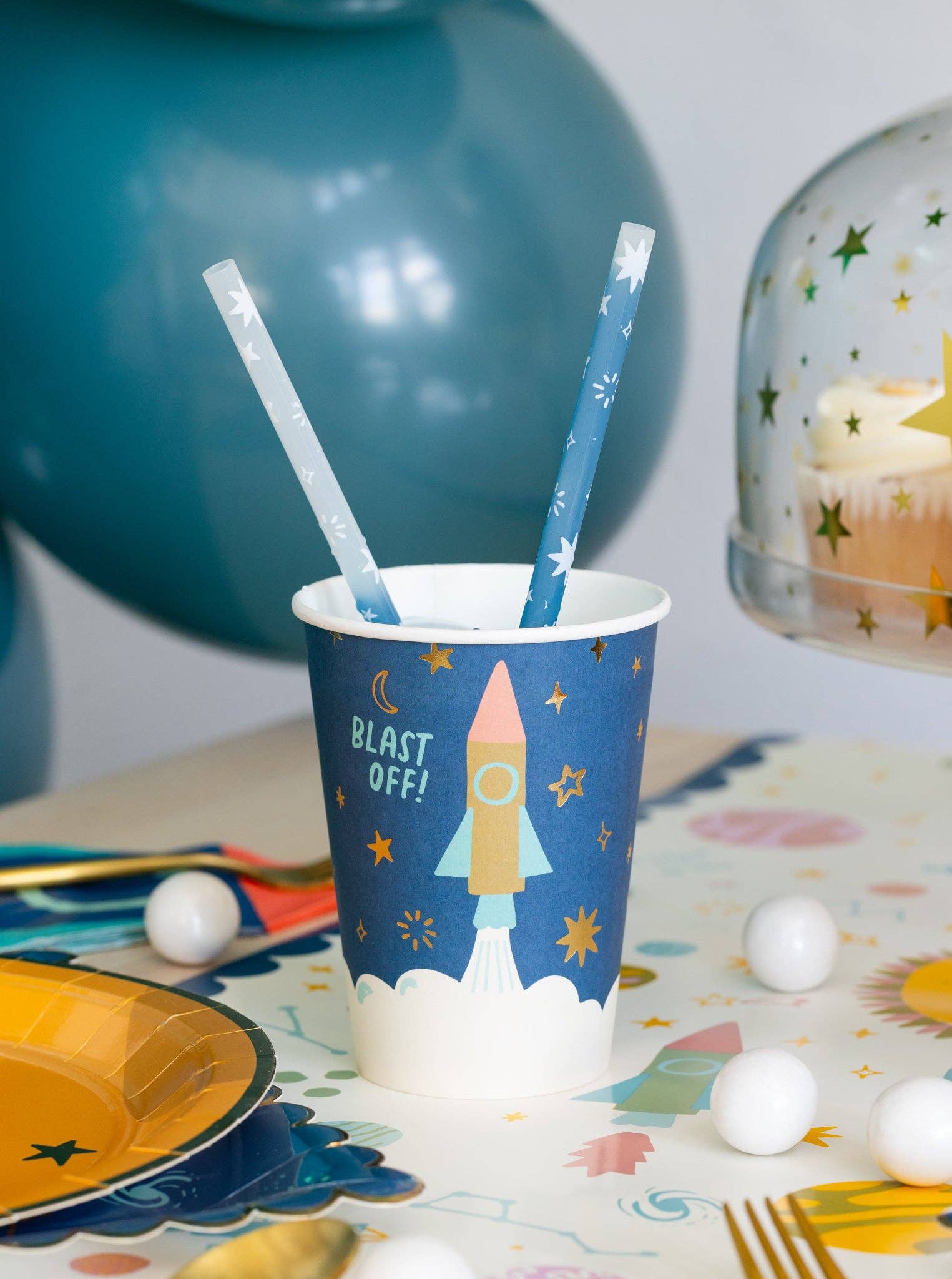 Fun space paper party cups, 12 oz with gold foil accents, perfect for galaxy-themed events.