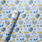 Happy Hanukkah Wrapping Paper. Festive blue, white, and gold designs featuring menorahs, dreidels, Stars of David, and 'Happy Hanukkah' messages. 2.5 x 10 ft roll of durable, premium #20 weight paper, perfect for wrapping holiday gifts. Sealed in a polly bag with a label printed on the paper.