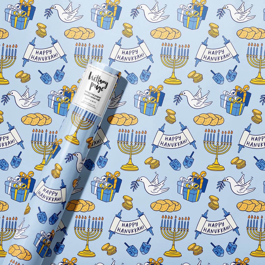 Happy Hanukkah Wrapping Paper. Festive blue, white, and gold designs featuring menorahs, dreidels, Stars of David, and 'Happy Hanukkah' messages. 2.5 x 10 ft roll of durable, premium #20 weight paper, perfect for wrapping holiday gifts. Sealed in a polly bag with a label printed on the paper.
