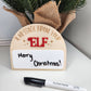 A personalized Elf on the Shelf dry-erase board made from 1/8" birch and acrylic. The board features a laser-cut and engraved design, perfect for adding creative messages from your elf this Christmas. Dry erase marker not included. Slight imperfections may be present due to the handmade nature of the product.