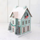 Cozy Christmas house decoration with battery-powered light, perfect for holiday tablescape, 4.5” x 6” size.