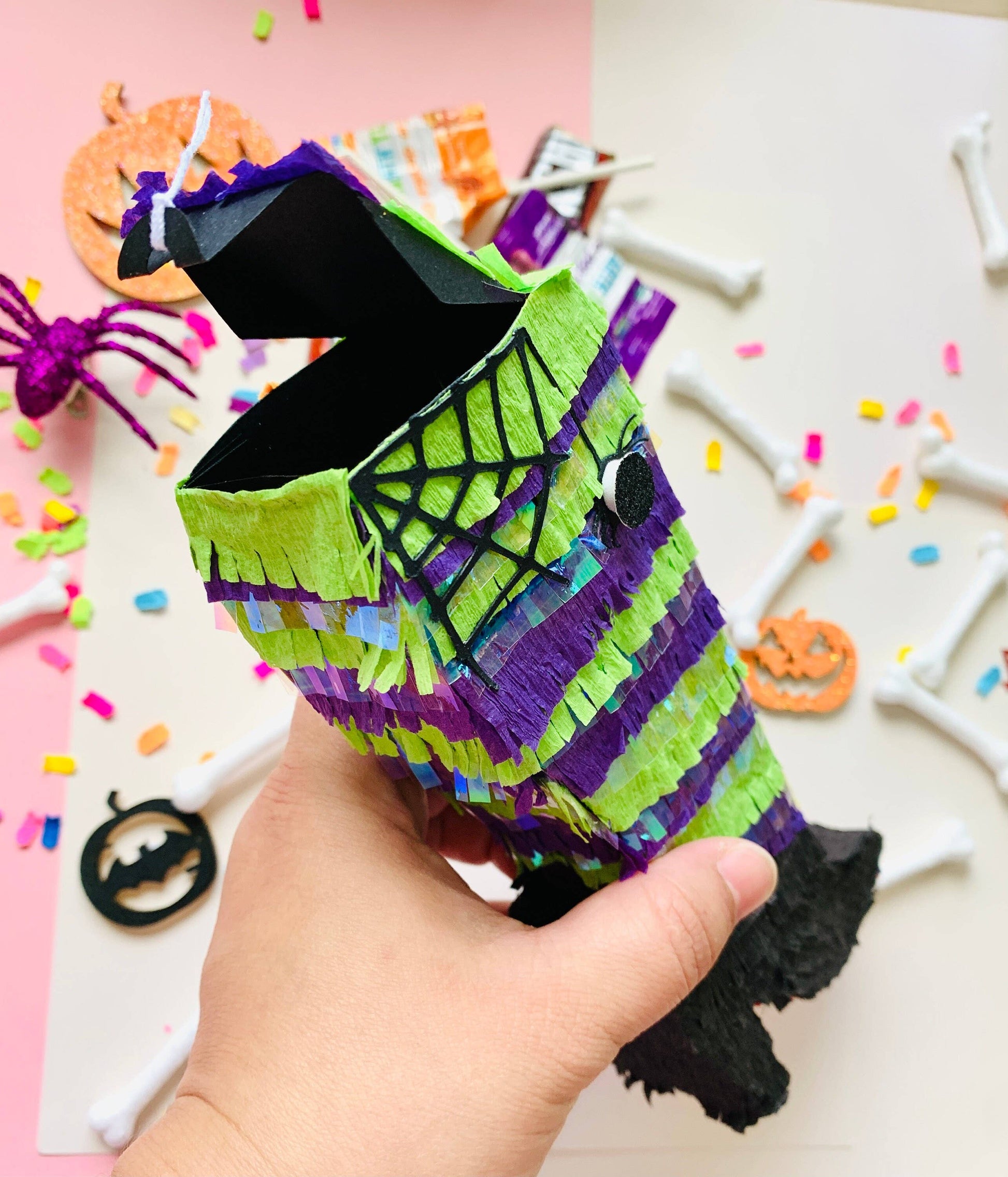 Halloween Witch Leg Mini Piñata, Ideal for Halloween Decorations and Party Favors, Measures 7 inches Tall, 3 inches Long, and 1.5 inches Wide, Features Trap Door for Treats.