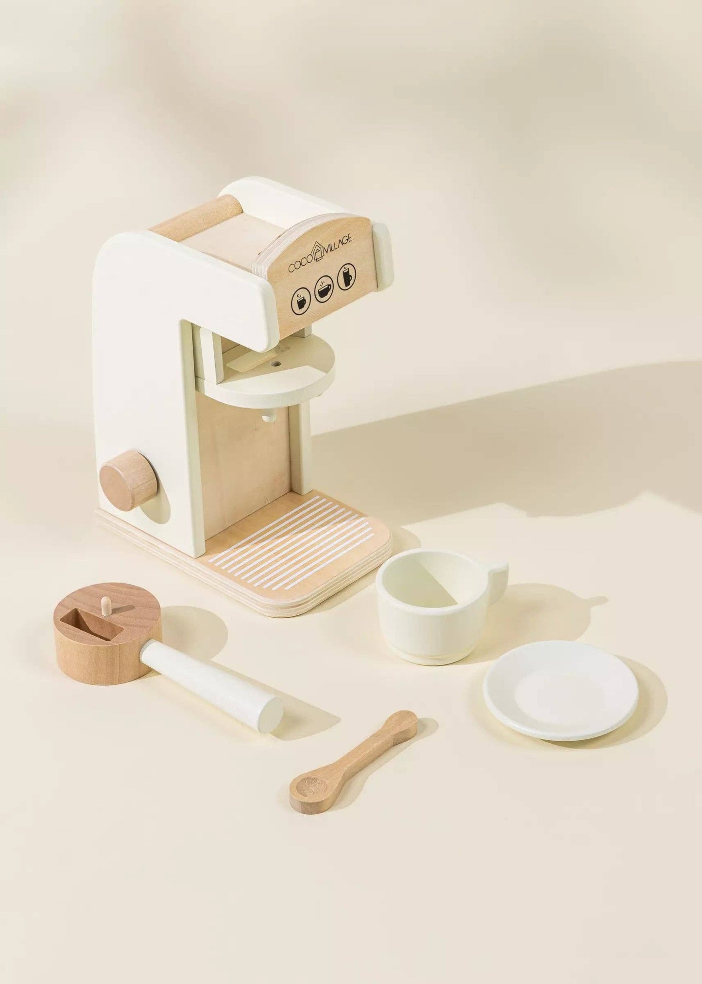 Wooden Coffee Maker Playset for kids with 4 coffee pods, cup, plate, spoon, cup holder, and 2 to-go cups. Perfect for imaginative play, allowing children to role-play as baristas, creating cappuccinos, lattes, and more. Encourages creativity and motor skills development.