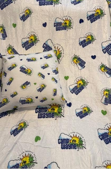 Plush camping throw blanket over a camp chair