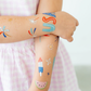 Sparkling temporary tattoos for 4th of July, featuring stars, stripes, and festive designs.