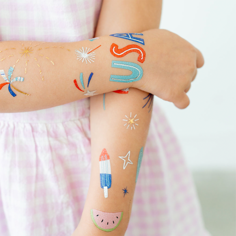 Sparkling temporary tattoos for 4th of July, featuring stars, stripes, and festive designs.