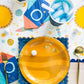 Space-themed 9” square plates with gold foil, 8 per pack, ideal for cosmic birthday parties.