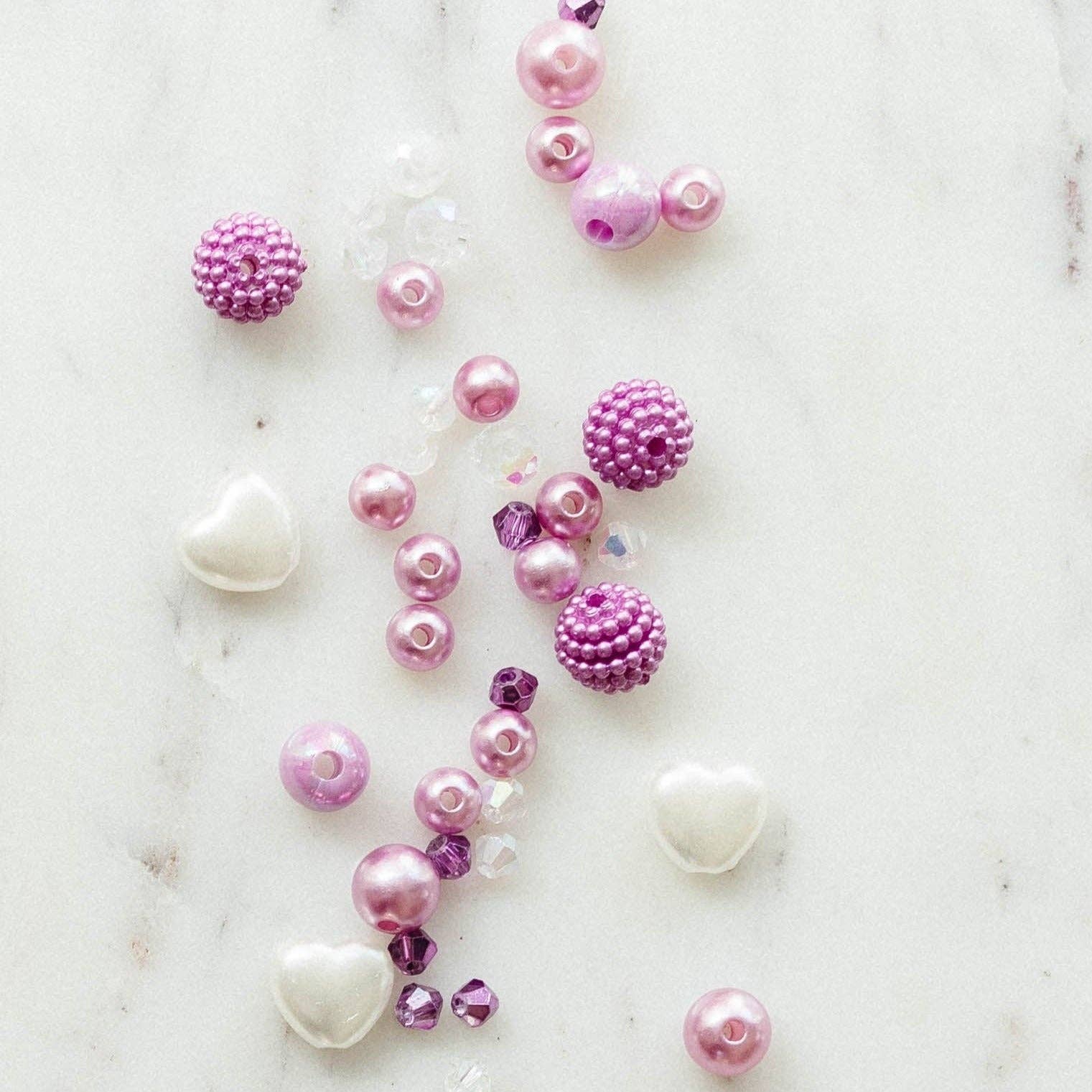 SWIFTIES 'Lavender Haze' Friendship Bracelet Kit with Light Purple Pearls, Crystals, and Heart Beads, Includes Personalization for 1 Word or Name, Comes in a Silver Bag.
