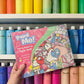 Swiftie art activity with paint pots and brush