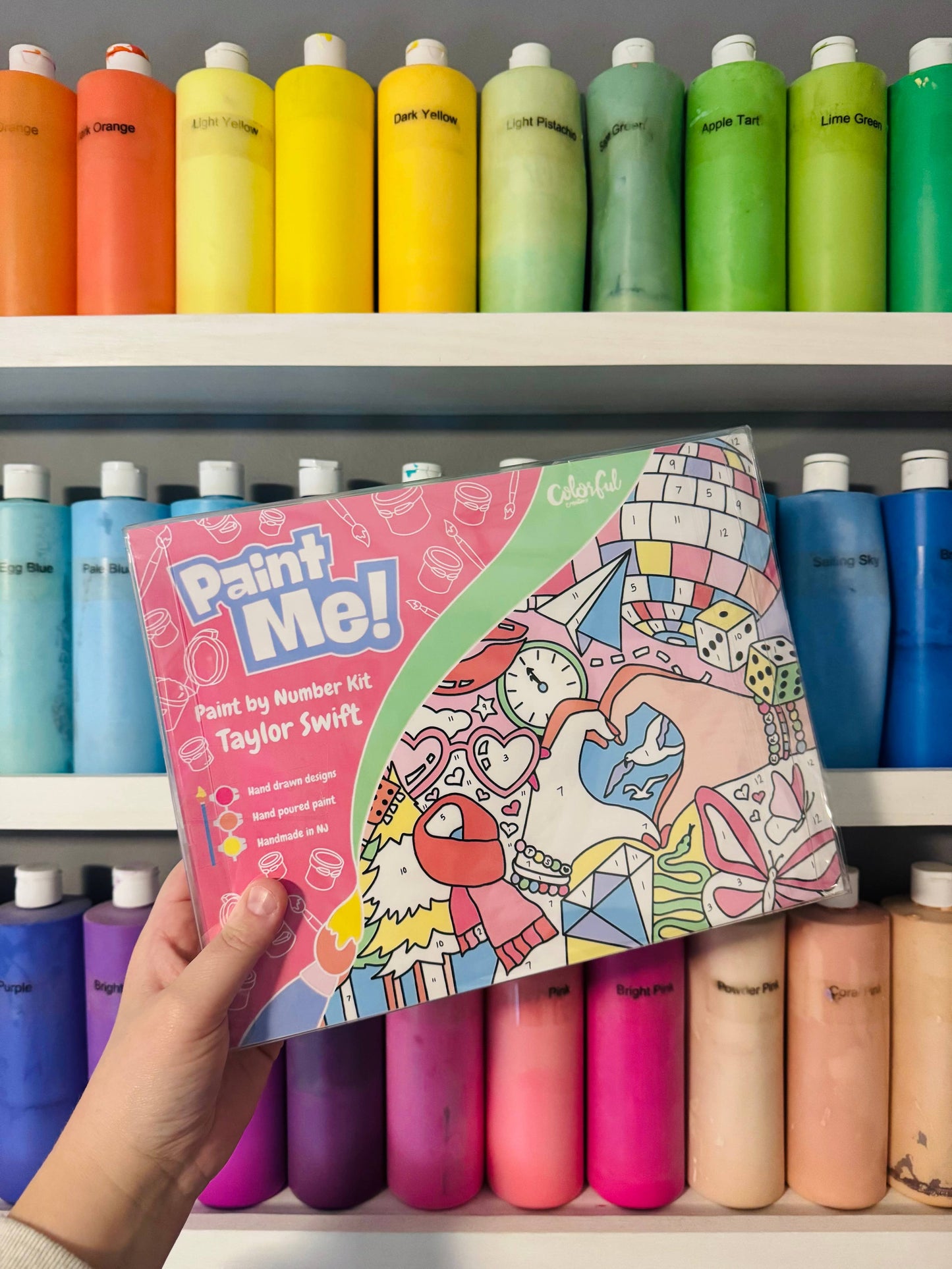 Swiftie art activity with paint pots and brush
