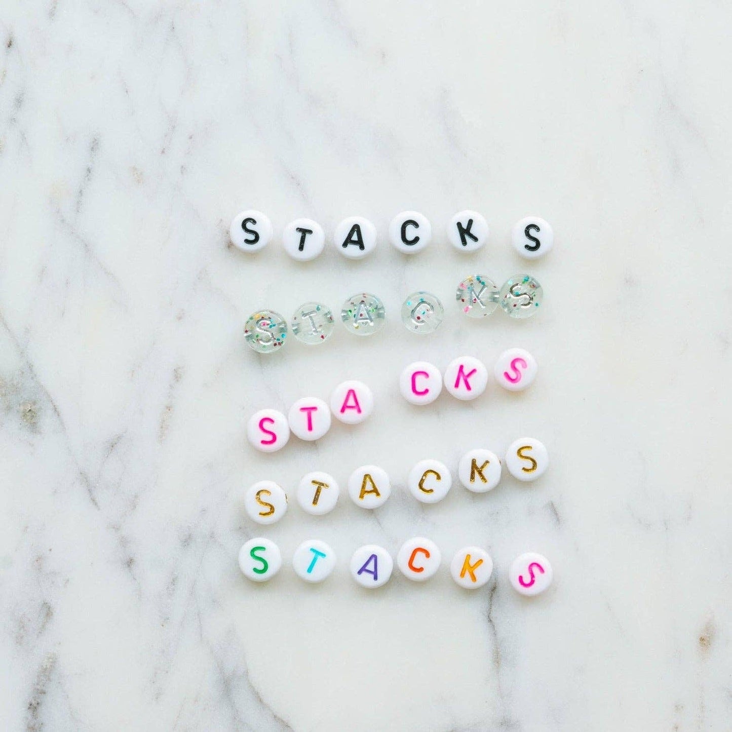 Create a festive Hanukkah stack with this bracelet kit featuring Star of David charms, pearls, and colorful beads. Makes 2+ bracelets (10-year-old sizing). WARNING: Small parts, choking hazard for children under 3. Adult supervision recommended.