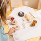 Wooden Bakery Playset for kids with baguette, croissant, pumpernickel, bagel, cutting board, and knife. Ideal for imaginative market play, helping children learn about different bread types, healthy eating, and colors. Perfect for pretend play with kitchen and market sets
