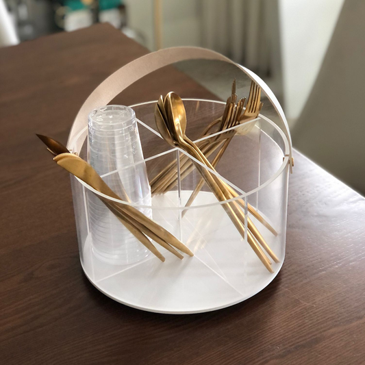 Stylish lucite caddy with leatherette handles, perfect for organizing cutlery, napkins & cups.
