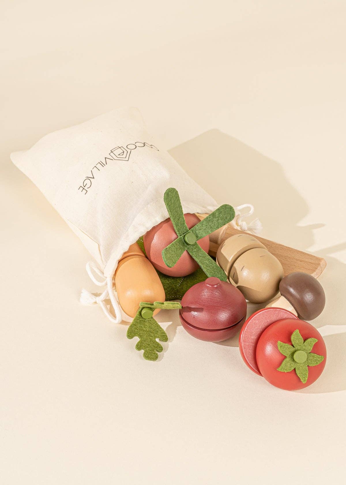 Wooden veggie playset with a basket, knife, and 7 colorful sliceable vegetables for kids' pretend play.