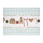 Charming gingerbread garland with candy canes, honeycomb balls, gingham bows, and festive pom-pom details.