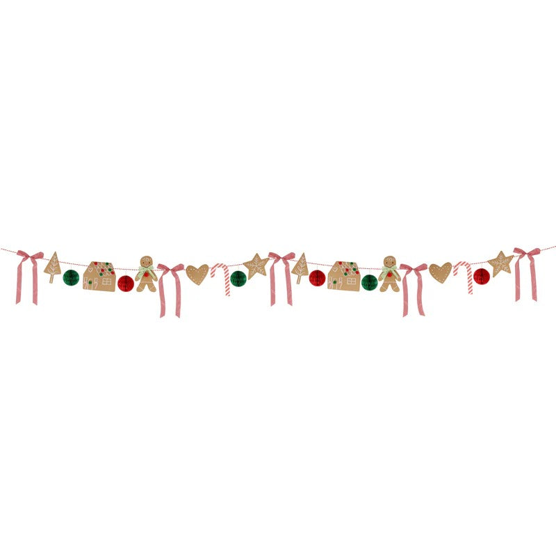 Charming gingerbread garland with candy canes, honeycomb balls, gingham bows, and festive pom-pom details.