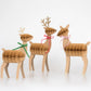 Elegant 3D reindeer family with honeycomb details, velvet ribbons, glittered antlers; perfect festive decor.