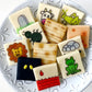 Passover ten plagues candy tile set – marzipan gift box featuring 12 handcrafted edible tiles.