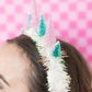 Colorful Christmas Tree Holiday Headband with glitter, felt trees, and tinsel. Festive, one-size-fits-most head bopper for holiday parties and celebrations.