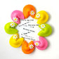 Easter marzipan fortune cookies with fun sayings inside, topped with daisies and glitter.